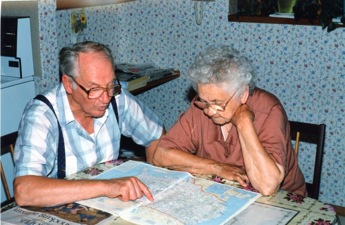 Opa sharing a map at the dining room table